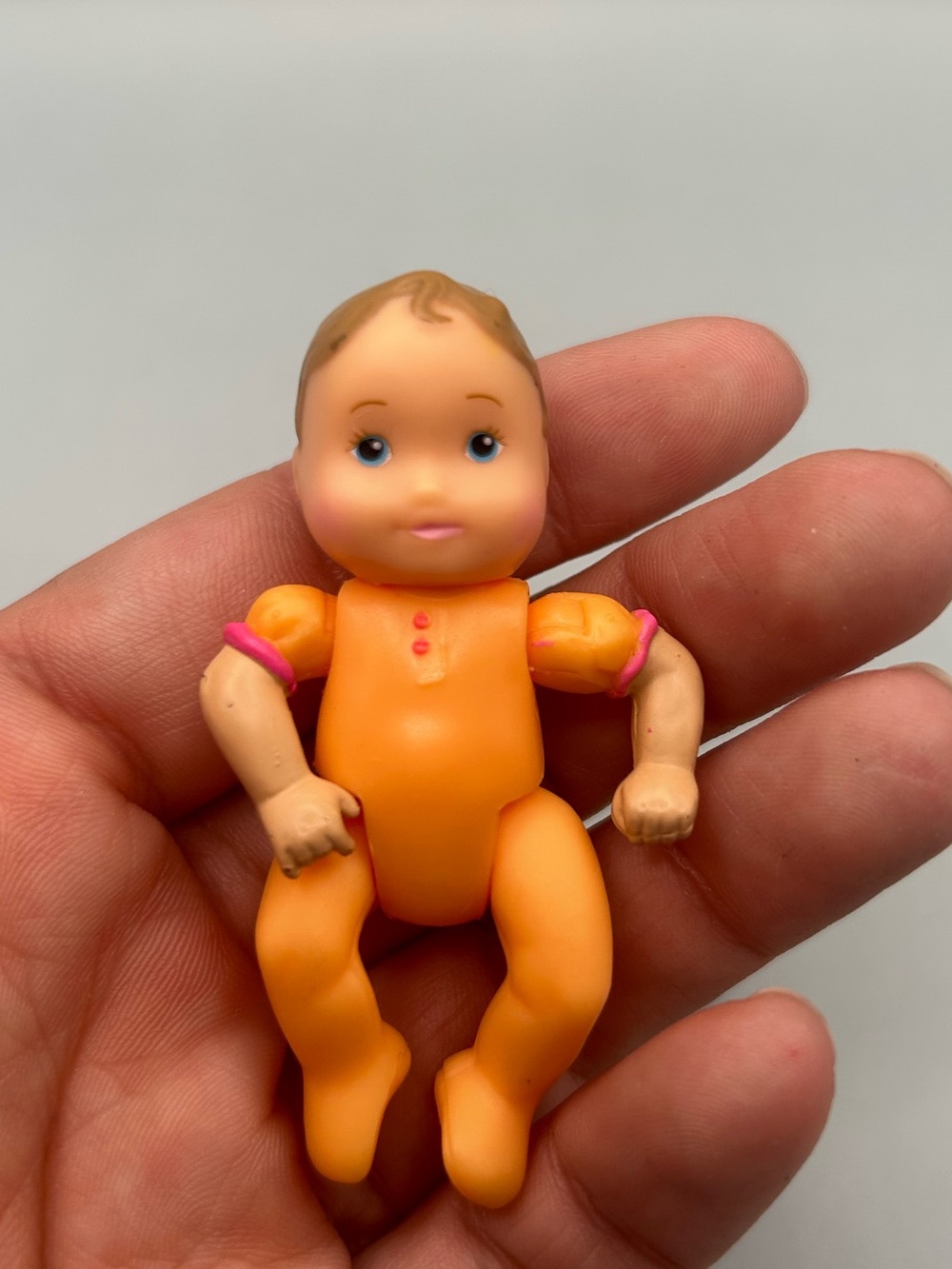 Fisher-Price Loving Family Dollhouse Mini Baby Doll in Orange Sleeper